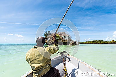 Arfican on the boat sailing to tha Rock restaurant in ocean Editorial Stock Photo