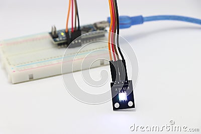 ARGB LED module connected to breadboard using jumper wires, Various electronic parts combined to make amazing science projects Stock Photo