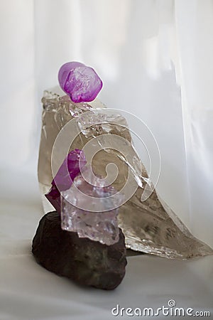 Arge quartz crystal and bright scarlet stones Stock Photo