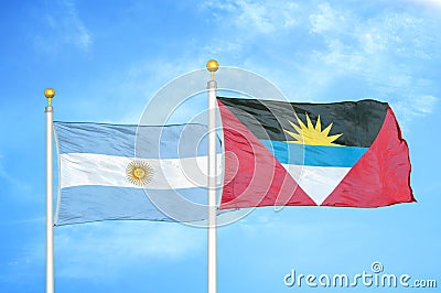 Argentina and Antigua and Barbuda two flags on flagpoles and blue sky Stock Photo