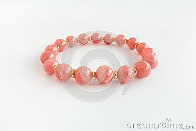 Argentina Rhodochrosite Bracelet with Gold Findings Isolated on White Stock Photo