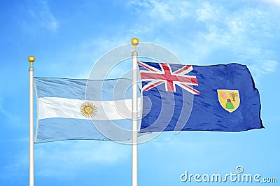 Argentina and Turks and Caicos Islands two flags on flagpoles and blue sky Stock Photo