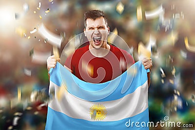 Argentine fan, fan of a man holding the national flag of Argentina in his hands. Soccer fan in the stadium. Mixed media Stock Photo