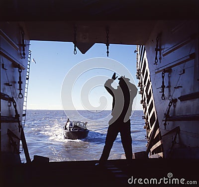 Argentine marine infantry disembarking on the coast with sea and amphibious vehicles and soldiers, historic battle of the Malvinas Editorial Stock Photo