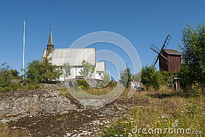 Arholma church and windmill Editorial Stock Photo