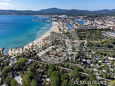 Arial view on blue water of Gulf of Saint-Tropez, sandy beach, houses in Port Grimaud, village on Mediterranean sea with yacht Stock Photo