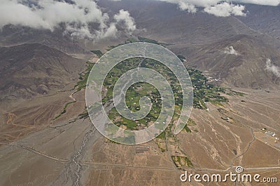 Arial view Green Landscape amidst Dry land around Leh from Flight window, Ladakh, India Stock Photo