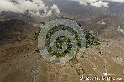 Arial view Green Landscape amidst Dry land around Leh from Flight window, Ladakh, India Stock Photo