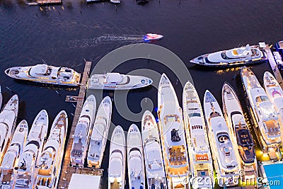 Ariel direct overhead shot of luxury Super yachts lit at night Fort Lauderdale international boat show Editorial Stock Photo