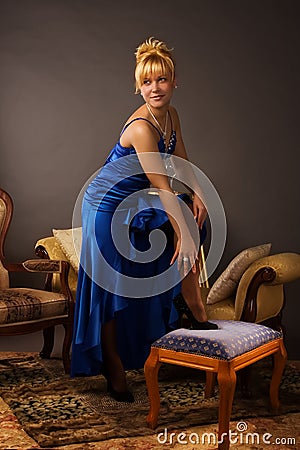 Aristocratic lady in a dark blue dress Stock Photo