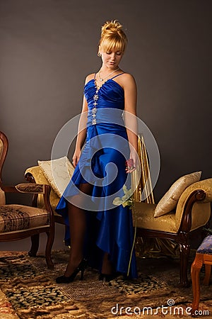 Aristocratic lady in a dark blue dress Stock Photo