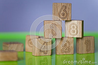 Arithmetic, mathematic, learning concept, numbers background with wooden cubes. Shallow Depth of Field Stock Photo