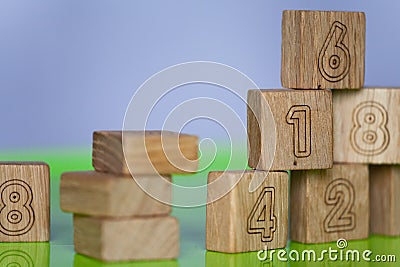 Arithmetic, mathematic, learning concept, numbers background with wooden cubes. Shallow Depth of Field Stock Photo
