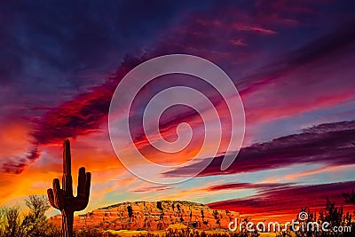 Arizona sunset all the colors of the rainbow and a view of the Coconino Cathedral mountains. Stock Photo