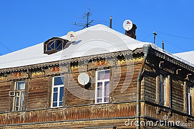 Arkhangelsk, Russia, February, 20, 2018. TV antennas on the roof of an old wooden mansion on Chumbarov-Luchinsky Avenue Editorial Stock Photo