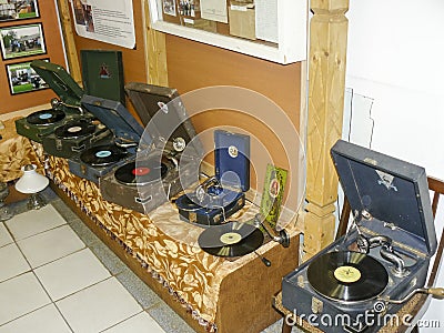 Old record players of vinyl discs. The gramophones and gramophones in the box. Editorial Stock Photo