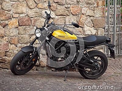 ARKUA PETRARKA, ITALY - AUGUST 13, 2019: motorcycle on the pavement of the old city Editorial Stock Photo