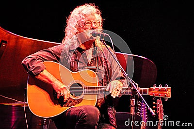 Arlo Guthrie talks with his audience during a live concert Editorial Stock Photo