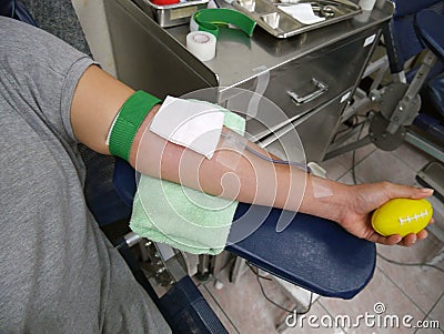 Arm of blood doner during blood donation Stock Photo