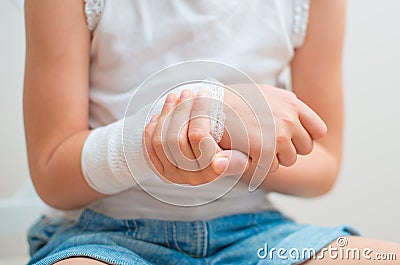 Arm with gauze bandage. Stock Photo