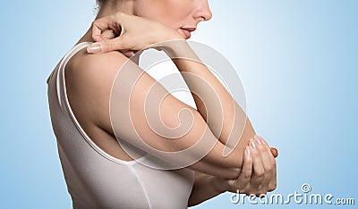 Arm pain and injury concept. Closeup side profile woman with painful elbow Stock Photo