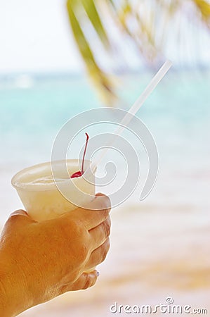 Arm rum relaxation ocean palm vacation Stock Photo