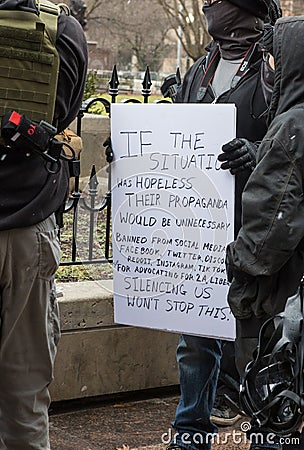 Armed Demonstrator Holds a Sign at the Ohio Statehouse Ahead of Biden`s Inauguration Editorial Stock Photo