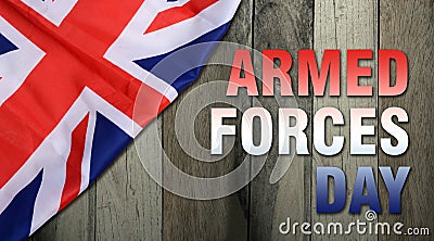 Armed forces day on wooden background - flag of the United Kingdom UK Stock Photo