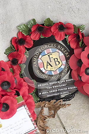 Armed Forces poppy wreath laid on a memorial Editorial Stock Photo