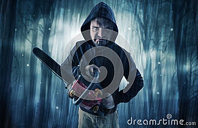 Armed hitman in dark nocturnal forest concept Stock Photo