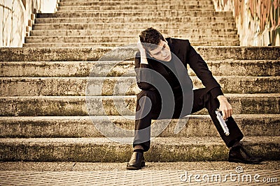 Armed man in stairs Stock Photo