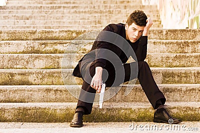 Armed man in stairs Stock Photo