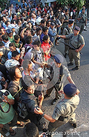 Armed police stan guard behind police line Editorial Stock Photo