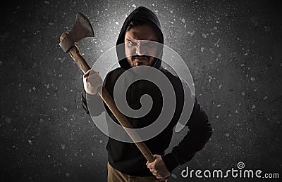 Armed villain in an empty dark room Stock Photo