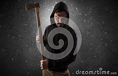 Armed villain in an empty dark room Stock Photo