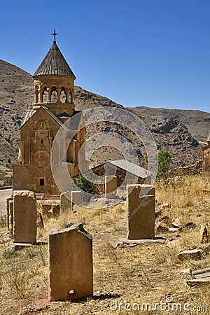 Armenia, Noravank: Mausoleum church with typical Armenian cross stones in foreground. Editorial Stock Photo