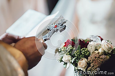 Armenian priest holding the cross for bride and groom Stock Photo