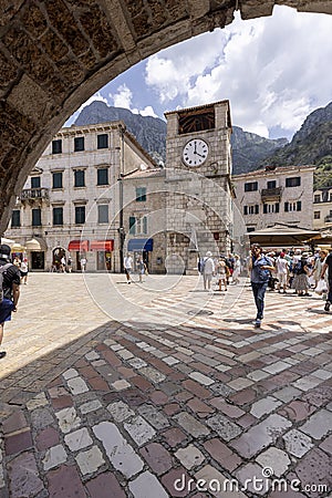 Arms Square with medieval Clock Tower, view from the Sea Gate, Kotor, Montenegro Editorial Stock Photo