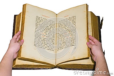 Arms are turn over the pages of opened old book Stock Photo