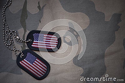 Army blank, dog tag with flag of united states of america on the khaki texture background. Stock Photo