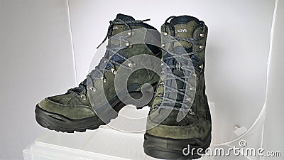 Army hiking alpine boots for adventurous trips Stock Photo