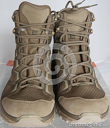 Army hiking alpine boots for adventurous trips Stock Photo