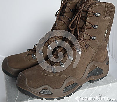 Army hiking alpine boots for adventurous trips Stock Photo