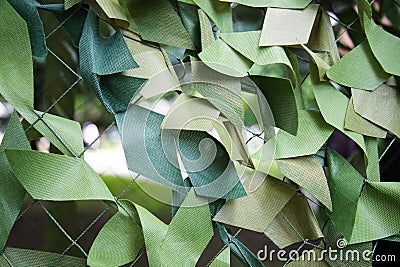 Army Military Weathered Masking Camouflage Net Background . Close Up View. Stock Photo