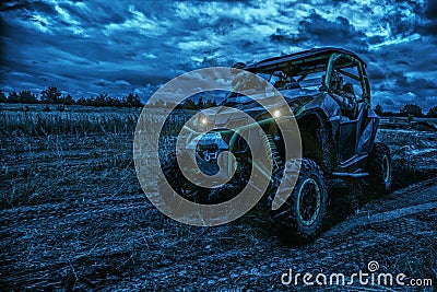 Army rangers moving on military buggy at night Stock Photo