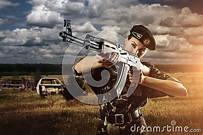 Army soldier woman is on the battle field Stock Photo