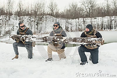 Army soldiers have hard training with huge chump wood Stock Photo