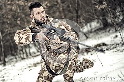 Army trooper with gun and rifle in operation on battlefield Stock Photo