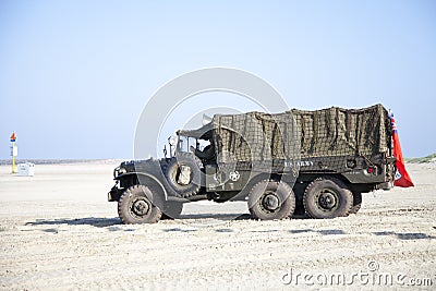 Army trucks of organization Kelly's Heroes riding on beach Editorial Stock Photo