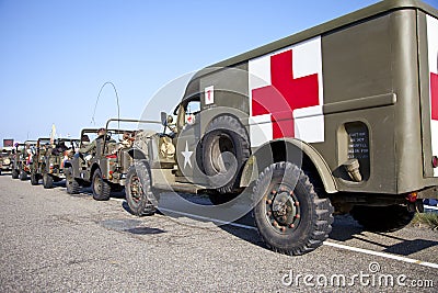 Army trucks of organization Kelly's Heroes riding on beach Editorial Stock Photo